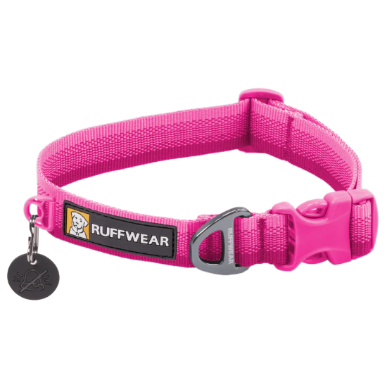 A bright pink Ruffwear dog collar with a silver metal D-ring and a black plastic buckle, featuring a black brand label with a dog logo and a small black hanging tag.