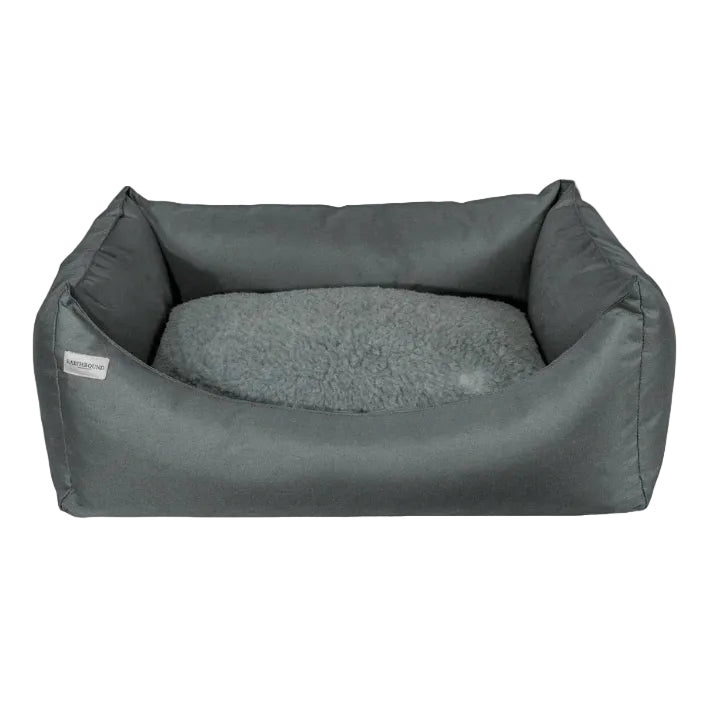 Gray pet bed with soft cushion on a white background