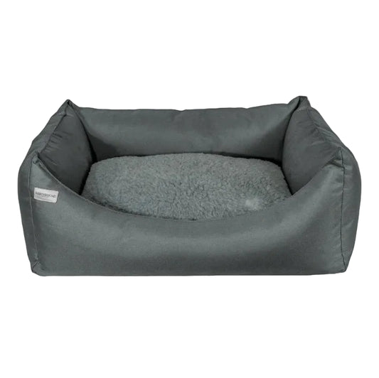 Gray pet bed with soft cushion on a white background