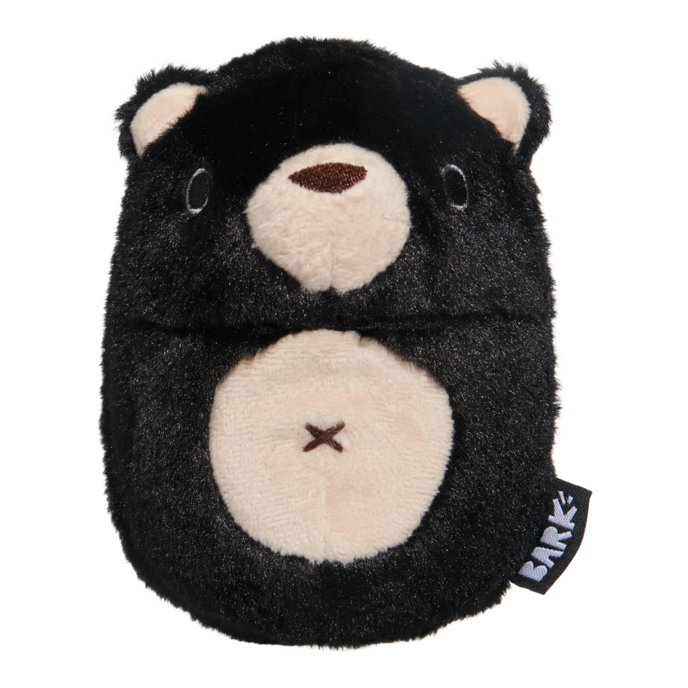 Black and beige plush toy with 'Bark' tag on a white background