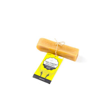 Load image into Gallery viewer, Block of yak cheese with a yellow label on a white background