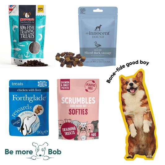 Collection of dog treats and a dog-shaped sign with text and branding.
